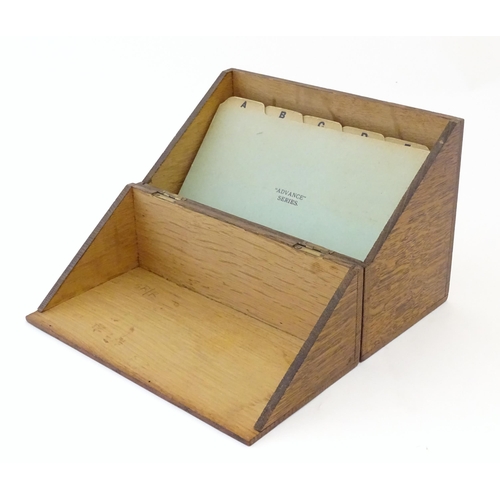 1064 - A 20thC oak correspondence / address box. Approx. 6