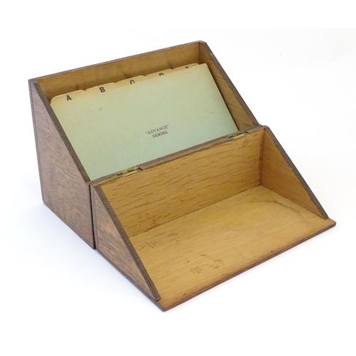 1064 - A 20thC oak correspondence / address box. Approx. 6