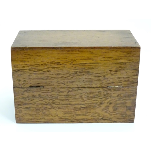 1064 - A 20thC oak correspondence / address box. Approx. 6