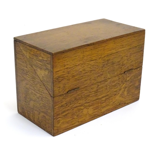 1064 - A 20thC oak correspondence / address box. Approx. 6