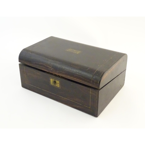 1073 - A Victorian coromandel writing slope / box with brass stringing detail. Inset maker's plaque within,... 