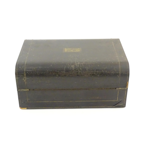 1073 - A Victorian coromandel writing slope / box with brass stringing detail. Inset maker's plaque within,... 