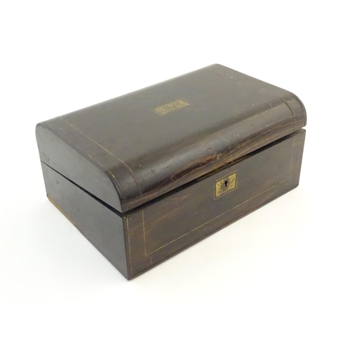 1073 - A Victorian coromandel writing slope / box with brass stringing detail. Inset maker's plaque within,... 