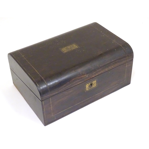 1073 - A Victorian coromandel writing slope / box with brass stringing detail. Inset maker's plaque within,... 