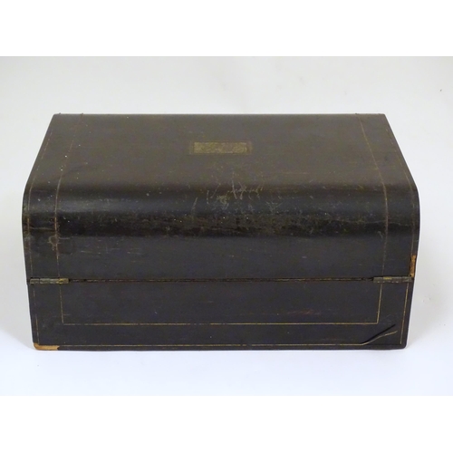 1073 - A Victorian coromandel writing slope / box with brass stringing detail. Inset maker's plaque within,... 