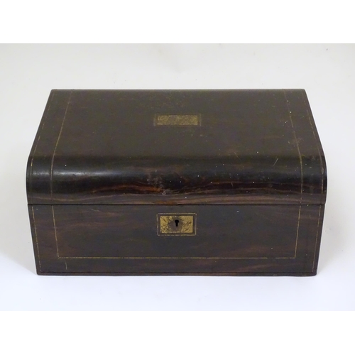 1073 - A Victorian coromandel writing slope / box with brass stringing detail. Inset maker's plaque within,... 