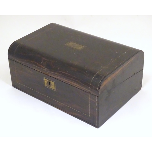 1073 - A Victorian coromandel writing slope / box with brass stringing detail. Inset maker's plaque within,... 