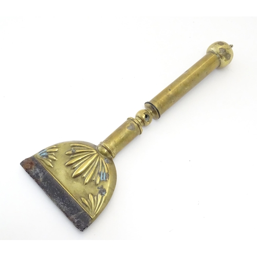 1075 - A 19thC brass horse hair singer / singeing lamp with embossed shell detail. Approx. 13 3/4