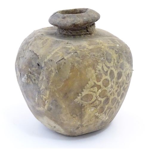 1082 - A leather / hide vase / vessel with applied geometric detail. Possibly Indian / Nepalese. Approx. 7