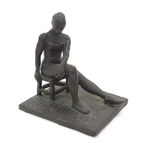 1083 - A 20thC clay sculpture modelled as a seated ballerina. Singed J. Paul to base. Approx. 7 1/4