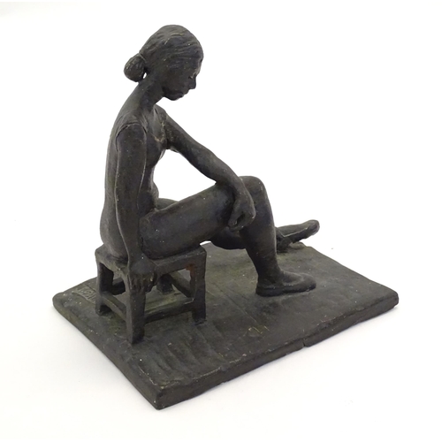 1083 - A 20thC clay sculpture modelled as a seated ballerina. Singed J. Paul to base. Approx. 7 1/4