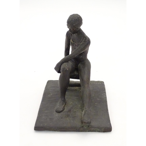 1083 - A 20thC clay sculpture modelled as a seated ballerina. Singed J. Paul to base. Approx. 7 1/4