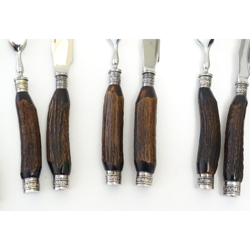 1091 - A 20thC cased set 6 of antler handled steak knives and forks. Case approx. 1 1/2