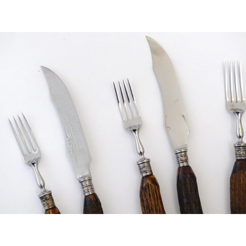 1091 - A 20thC cased set 6 of antler handled steak knives and forks. Case approx. 1 1/2