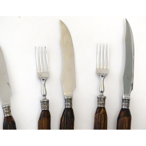 1091 - A 20thC cased set 6 of antler handled steak knives and forks. Case approx. 1 1/2