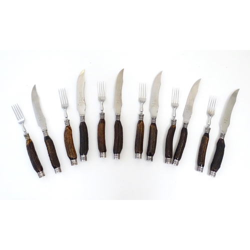 1091 - A 20thC cased set 6 of antler handled steak knives and forks. Case approx. 1 1/2