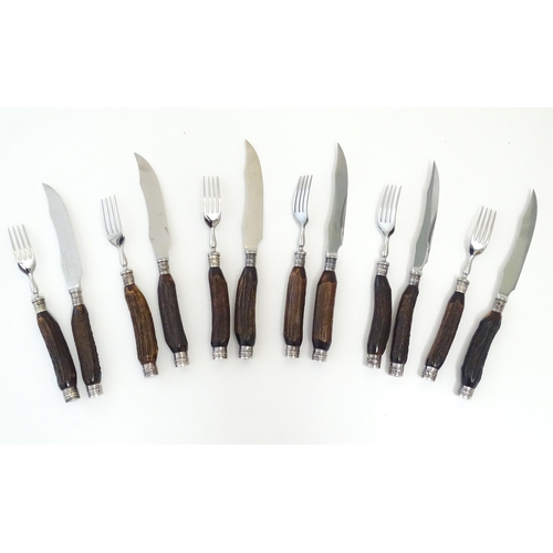 1091 - A 20thC cased set 6 of antler handled steak knives and forks. Case approx. 1 1/2