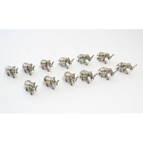 1095 - Twelve silver plate menu holders modelled as elephants. Approx. 2 1/4