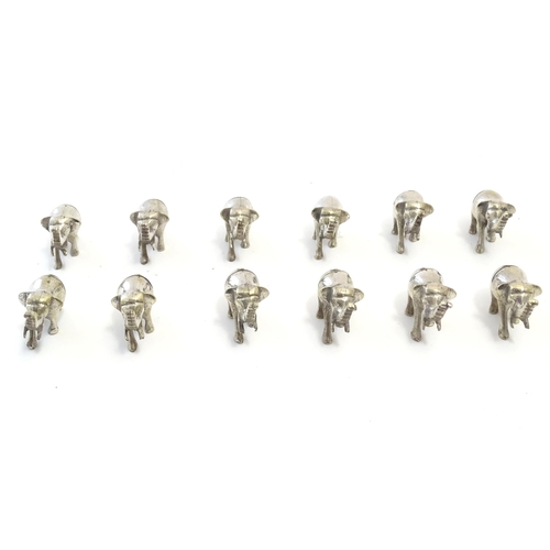 1095 - Twelve silver plate menu holders modelled as elephants. Approx. 2 1/4