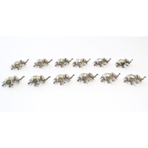 1095 - Twelve silver plate menu holders modelled as elephants. Approx. 2 1/4