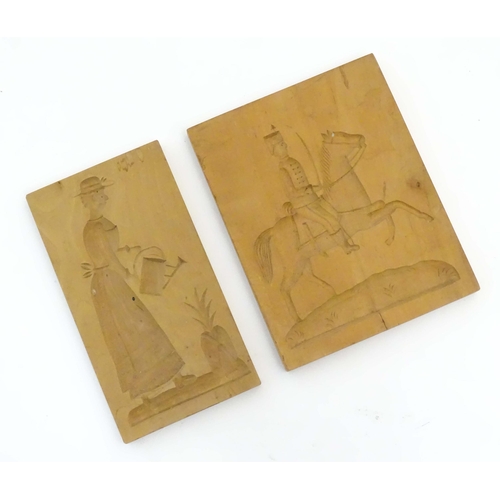 1099 - Two 20thC carved wooden shortbread / biscuit / cookie moulds, one depicting a soldier on horseback, ... 