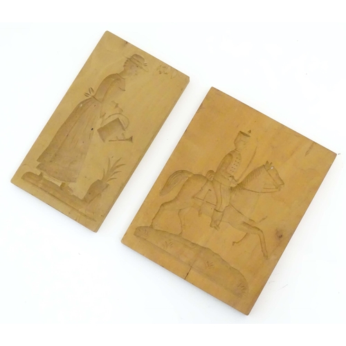 1099 - Two 20thC carved wooden shortbread / biscuit / cookie moulds, one depicting a soldier on horseback, ... 