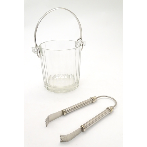 1106 - A 20thC glass and silver plate ice bucket with swing handle and silver plate tongs. Bucket approx. 5... 