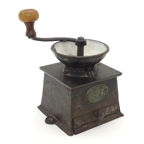 1107 - A Victorian cast iron coffee grinder / mill, by A. Kenrick & Sons. Approx. 6 1/2