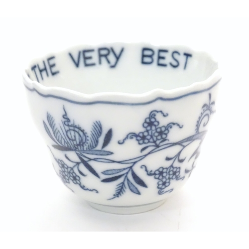 1108 - A late 19thC Continental blue and white ceramic tea bowl with floral and foliate decoration. The int... 