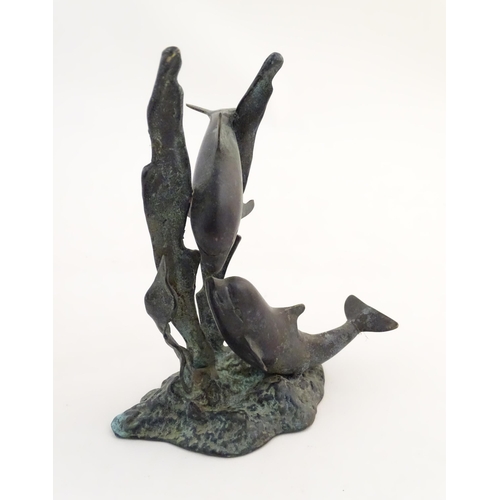 1122 - A 20thC cast bronze sculpture modelled as two dolphins swimming. Approx. 7 1/2