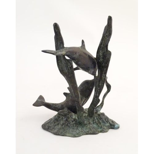 1122 - A 20thC cast bronze sculpture modelled as two dolphins swimming. Approx. 7 1/2