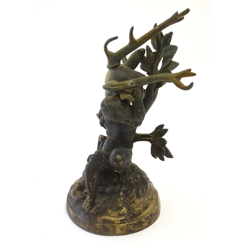 1123 - A 19thC cast brass model of a cherub / putto carrying a stag / deer head. Approx. 8 3/4