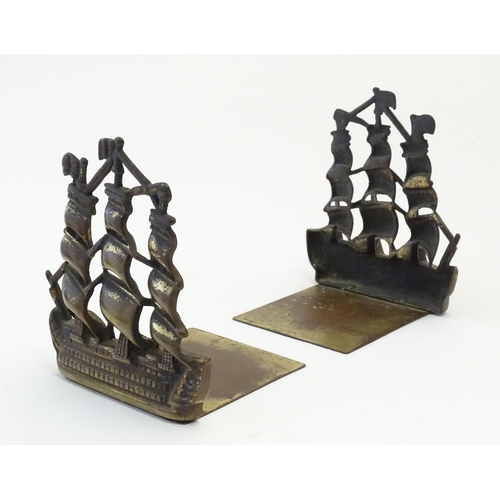 1128 - A pair of 19thC cast brass book ends modelled as the ship HMS Victory in full sail. Approx. 5 1/2