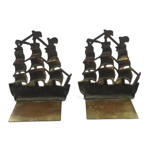 1128 - A pair of 19thC cast brass book ends modelled as the ship HMS Victory in full sail. Approx. 5 1/2