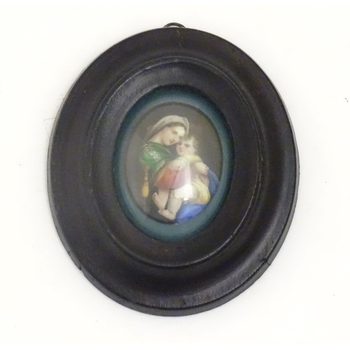 1140 - An early 20thC hand painted oval porcelain plaque depicting Madonna Della Sedia, mother and child, a... 