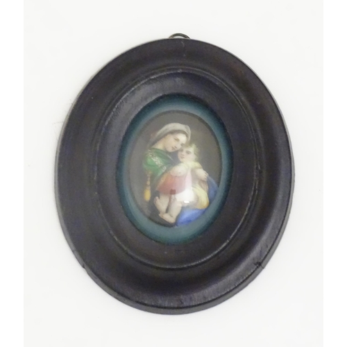 1140 - An early 20thC hand painted oval porcelain plaque depicting Madonna Della Sedia, mother and child, a... 