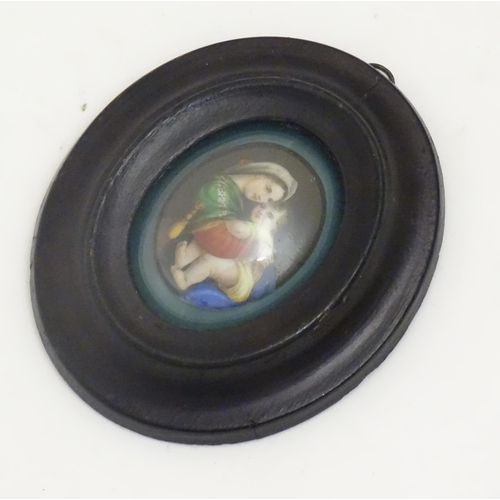 1140 - An early 20thC hand painted oval porcelain plaque depicting Madonna Della Sedia, mother and child, a... 