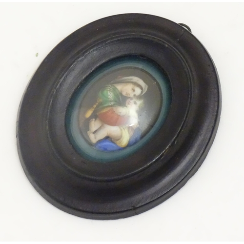 1140 - An early 20thC hand painted oval porcelain plaque depicting Madonna Della Sedia, mother and child, a... 