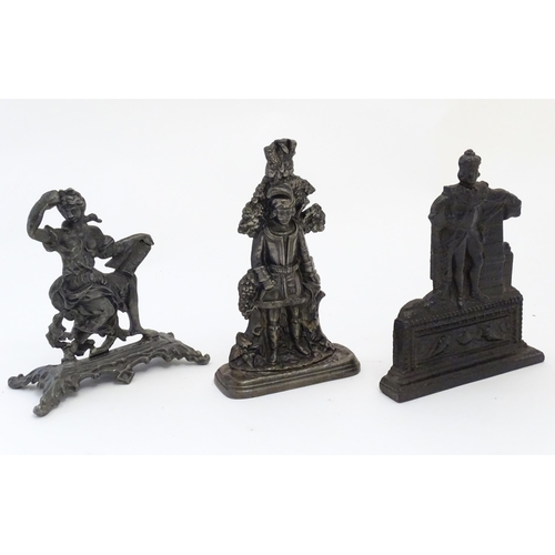 1180 - Three assorted cast fireplace / fireside ornaments / door stops / porters to include King William wi... 