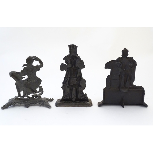 1180 - Three assorted cast fireplace / fireside ornaments / door stops / porters to include King William wi... 