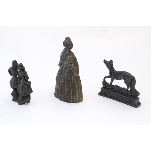 1184 - A quantity of assorted cast fireplace / fireside / chimney ornaments / door stops / porters to inclu... 