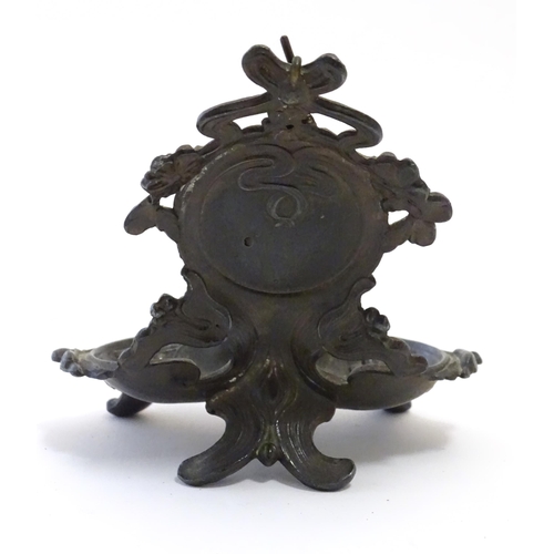 1186 - A late 19th / early 20thC cast pocket watch stand with crested ribboning, flowers and a shaped tray ... 