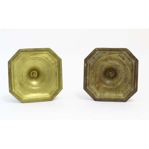 1191 - A pair of 20thC cast candlesticks with double knop faceted stems on a stepped square base with cante... 