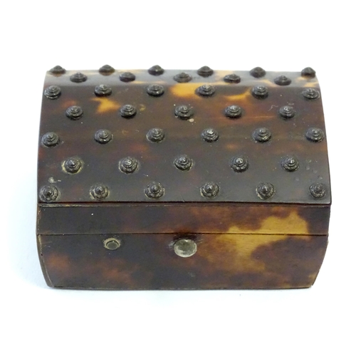 1197 - A 19thC miniature tortoiseshell box with stud detail to top. Approx. 1 1/4