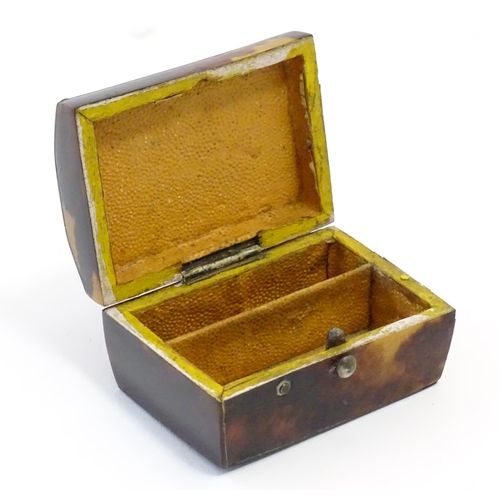 1197 - A 19thC miniature tortoiseshell box with stud detail to top. Approx. 1 1/4