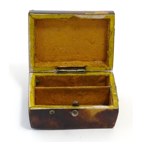 1197 - A 19thC miniature tortoiseshell box with stud detail to top. Approx. 1 1/4