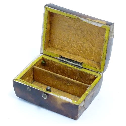 1197 - A 19thC miniature tortoiseshell box with stud detail to top. Approx. 1 1/4