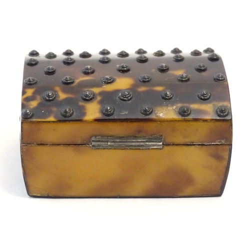 1197 - A 19thC miniature tortoiseshell box with stud detail to top. Approx. 1 1/4