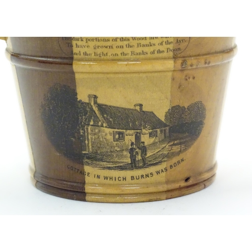 1211 - A 19thC Mauchline ware model of a milk pail with banded detail, decorated with a vignette depicting ... 