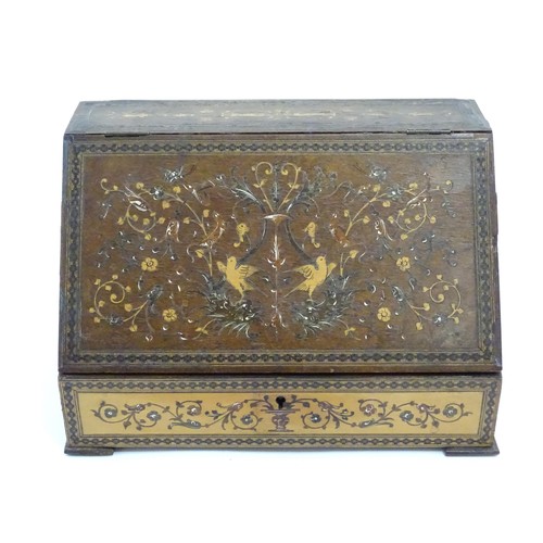 1213 - A 19thC Continental olivewood stationery box with letter rack within, with inlaid decoration depicti... 